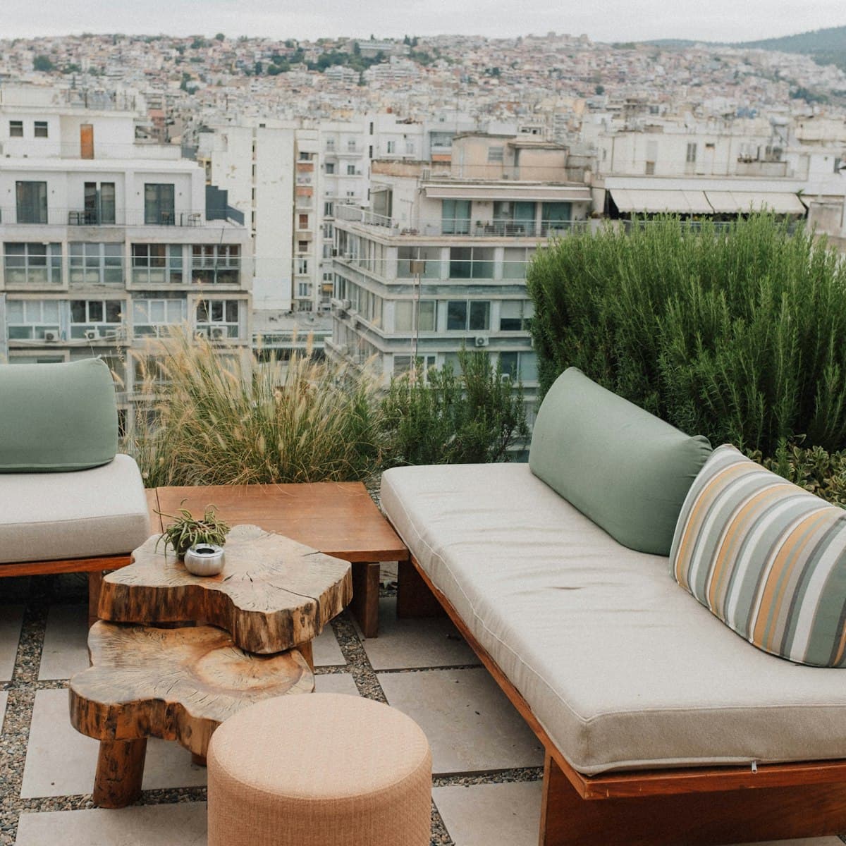 Rooftop terrace lounge surrounded by greenery